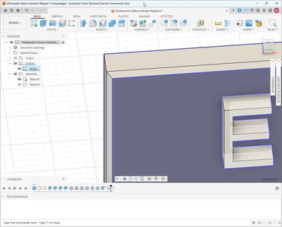 Close-up in Fusion of the blue panel’s corner, its outside edges chamfered, with the raised E of Empty beside it.