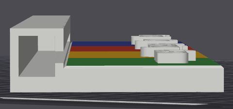 A print preview seen end-on, showing the inside of the box the arrow rides in, with the coloured layers and raised letters beside it.